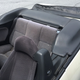 The hard to find tonneau cover was a gift from Cox’s girlfriend. The white pieces sticking up behind the seats are the clips he made.